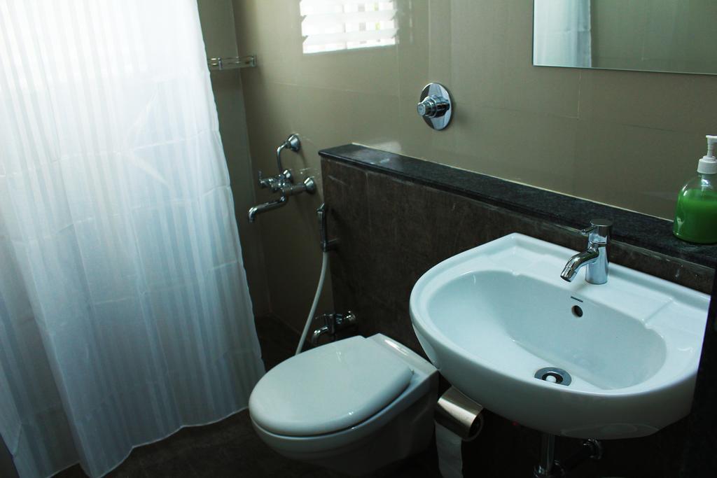 Aashiyana Inn Nashik Phòng bức ảnh